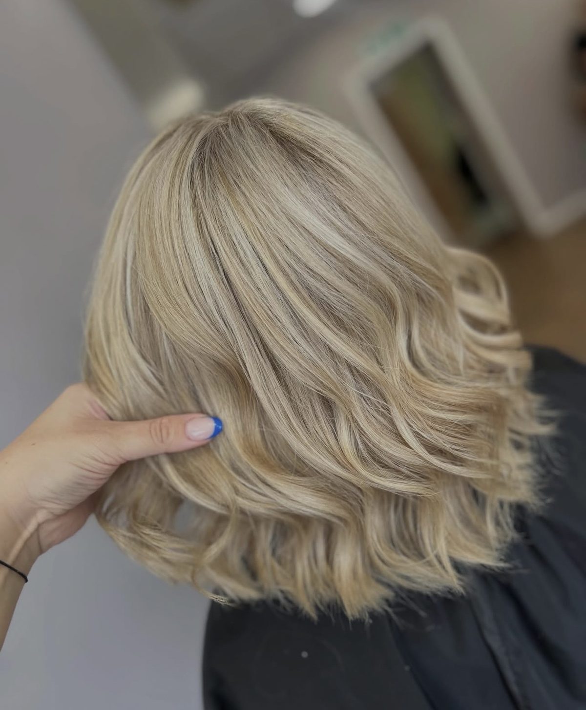 Golden blonde lob with soft waves