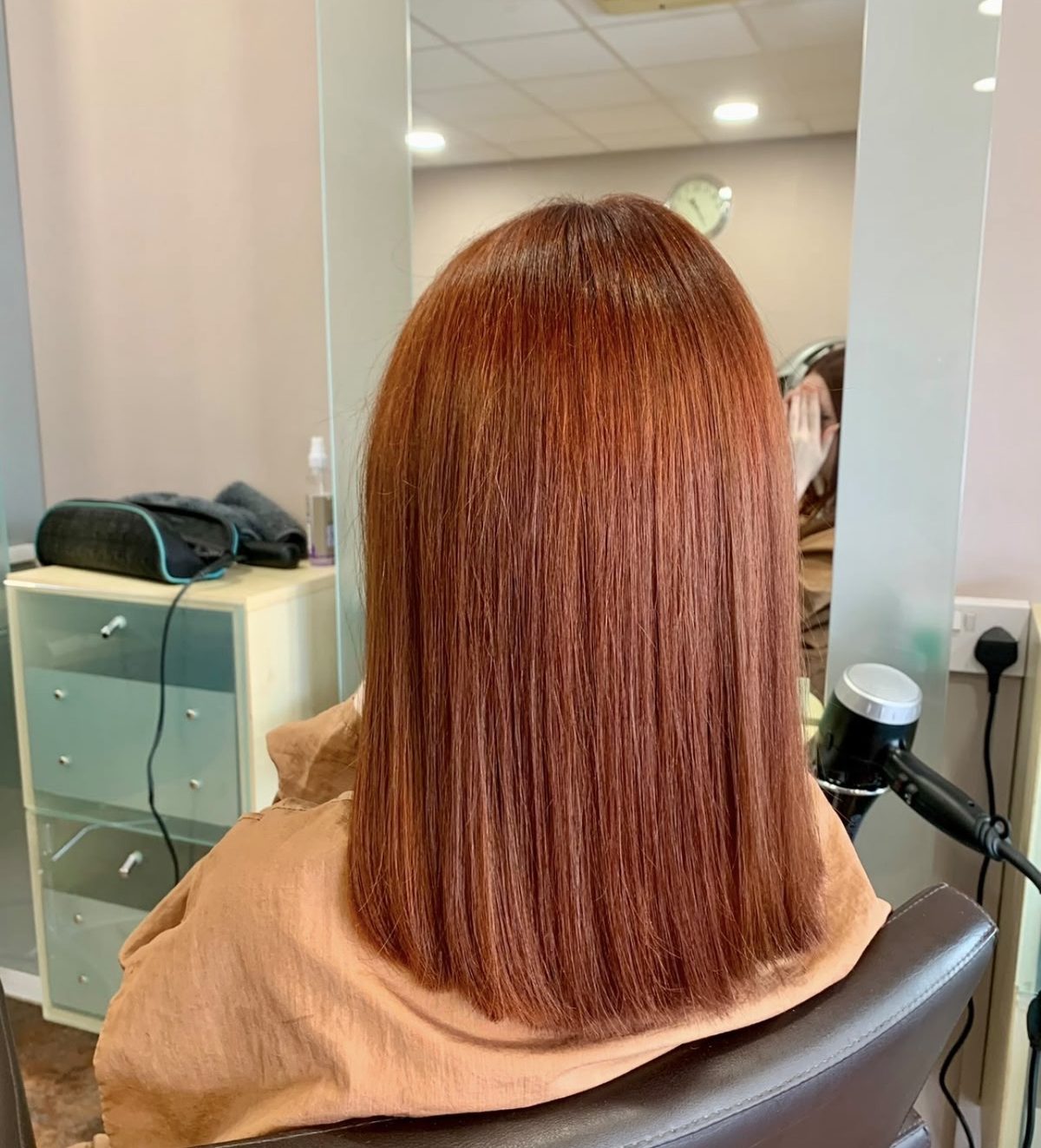 Vivid copper-red bob with a blunt finish
